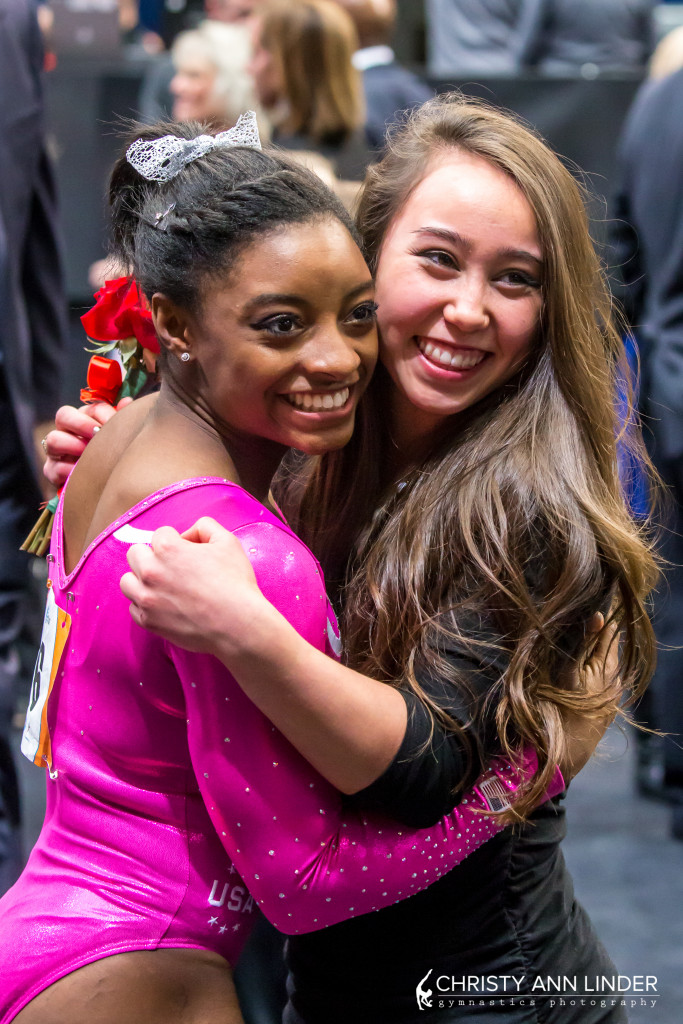 Simone Biles hugs Katelyn Ohashi after winning the 2015 American Cup.