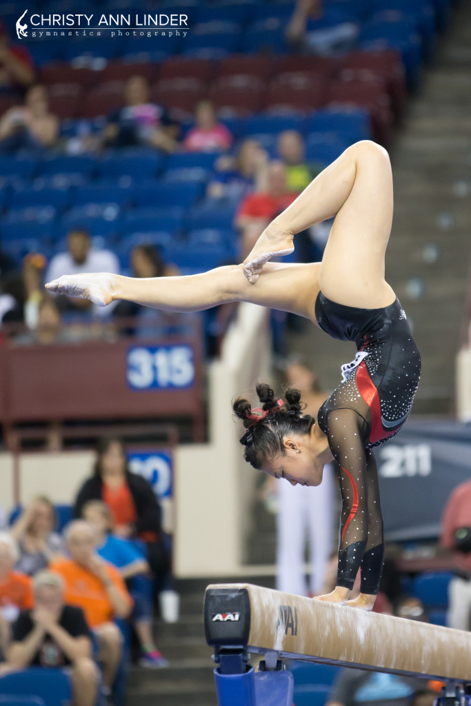 ivana hong handstand during beam finals at the 2015 ncaa championships