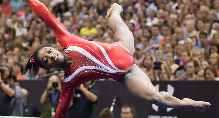 Simone Biles broke two world records and tied Kim Zmeskal's record for three consecutive national titles. © Christy Linder