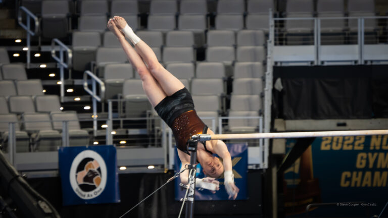 Jade Carey warming up bars.